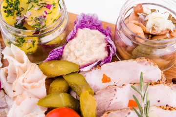 Russian traditional snack on a wooden board on a white background