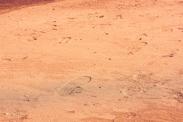Fototapeta na wymiar Footprint boot in the sand in the desert.