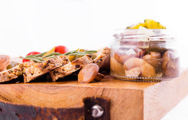 Russian traditional snack on a wooden board on a white background