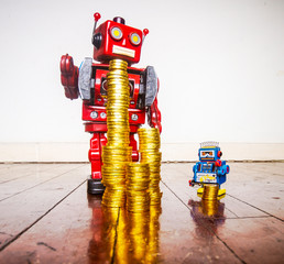 concept inequality with retro toy robots and gold toy money