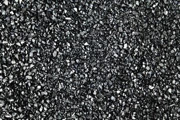 Close up abstract black background, monochrome texture with copy space. Black broken small glass