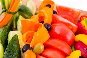 Fresh vegetables on a wooden board. Top view