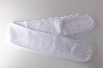 a velcro-type white exercise headband.