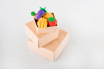 Delivery concept on a white background. Delivery of goods, food online. A lot of boxes with food on a white background close-up. 