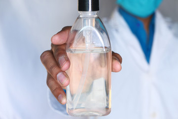 Doctor hand holding hand sanitizer for preventing virus 