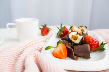 Cottage cheese with strawberries. Strawberries, chocolate, glazed cheeses. Beautiful photo of sweet cottage cheese for breakfast.