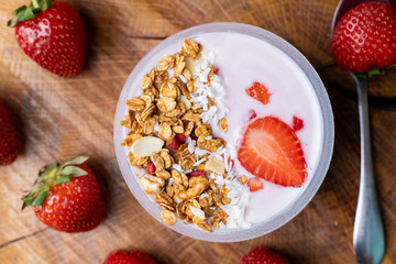 Breakfast with yogurt, granola, with superfood toppings, the view from the top. Concept of healthy eating, healthy lifestyle