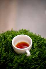 Cup of black filter coffee on the grass nature street cafe pour over alternative