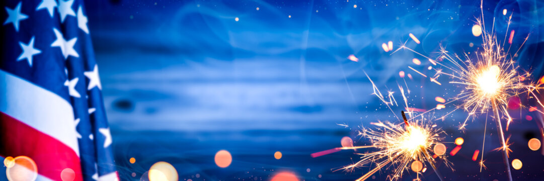American Flag With Sparklers And Smoke On Wooden Background - Independence Day Celebration Concept