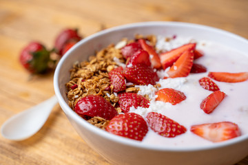 Breakfast with yogurt, granola, with superfood toppings, closeup view. Concept of healthy eating, healthy lifestyle