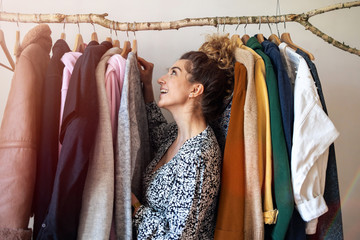 Young woman choosing clothes
