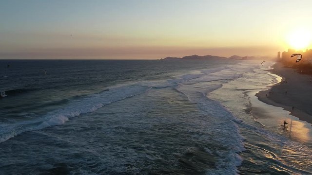 Sunset, paragliding, beach and islands