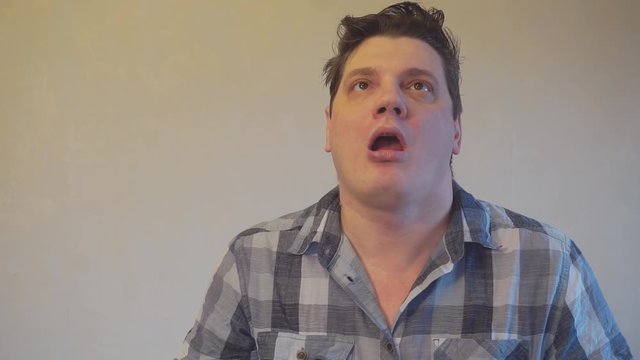 strange funny man trying to juggle ripe oranges