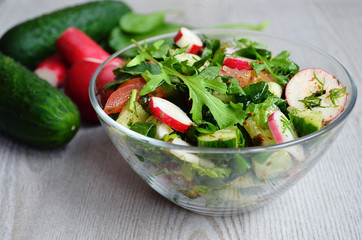 fresh summer vegetable salad with radishes and herbs