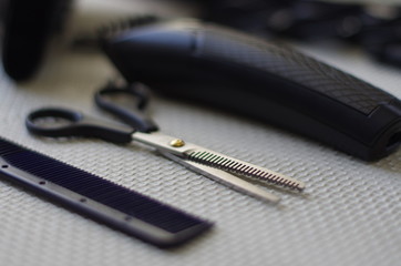 Working tools of barber master. Hair salon table with bokeh effect.