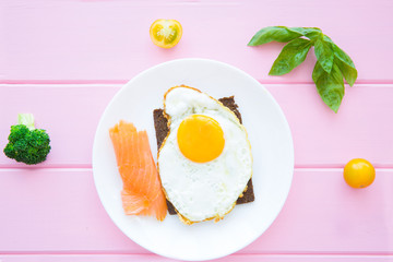 Toast with fried eggs and salmon  for lunch or brunch.