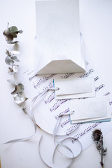 sheet of notes, printed letter, badges on a ribbon, silver plated twigs