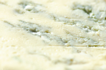 Gorgonzola blue blue cheese, traditional Italian delicacy close-up. Tasty food abstract background.