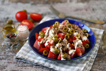 Selective focus. Fitness salad with tuna and olives and tartar sauce. Diet food.