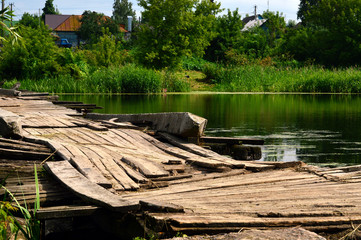very old wooden bridge over the river.