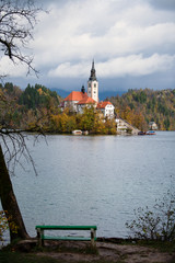 Autumn view of Bled lake in Julian Alps, Slovenia. Pilgrimage church of the Assumption of Maria on a foreground. Landscape photography