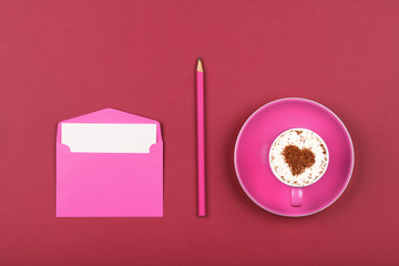 Pink paper letter envelope and coffee cup