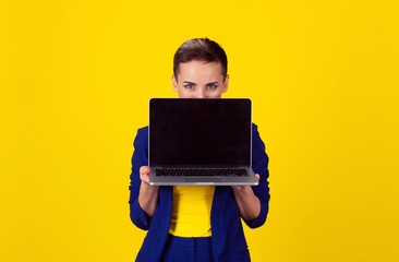 happy smiling businesswomen, hiding behind laptop