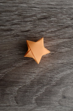 A Lucky Orange Star On Wooden