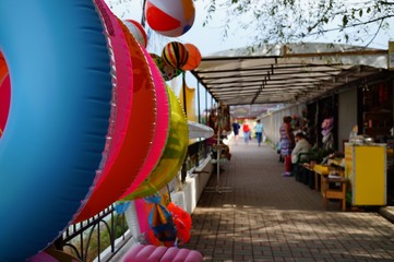 Shopping tent with toys near the sea.