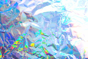 Abstract radiant festive backdrop texture image of holographic bokeh iridescent metallic foil