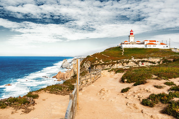 Fototapeta na wymiar Cabo da Roca is a cape which forms the westernmost point of both mainland Portugal, mainland Europe