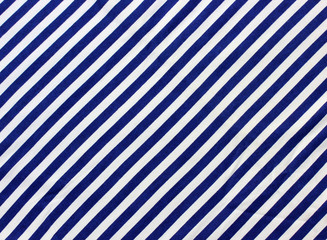 blue and white diagonal stripes. vest, marine backdrop.