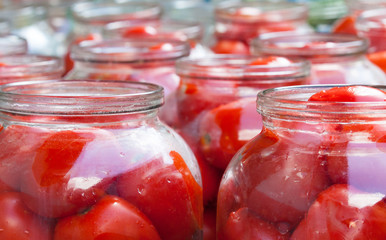 Pickling (canning) the tomatoes.
