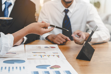 financial advisory services. Asian advisor showing plan of investment to clients in the consultancy...