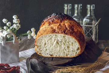 Fresh white wheat bread in the assortment of home-made sourdough. Bread made from wheat grains on a...