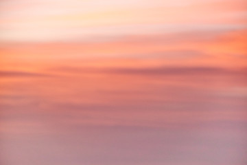 A beautiful blurred light red background of the evening sky
