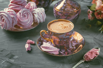 Beautiful vintage coffee Cup and handmade marshmallows on the table.