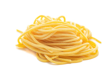 Fresh uncooked spaghetti pasta isolated on a white background