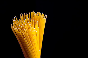 spaghetti on a black background