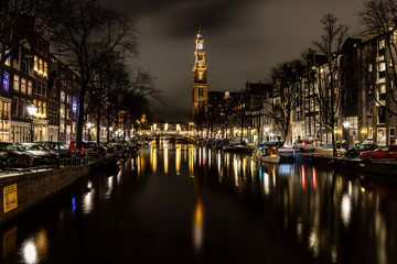 Fototapeta na wymiar Night lights of church, building and channels in Amsterdan