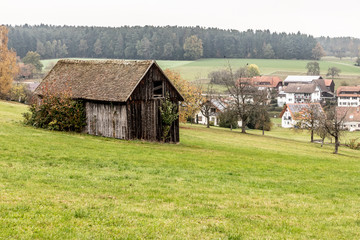 Fototapeta na wymiar Field, houses and forest around Calw village