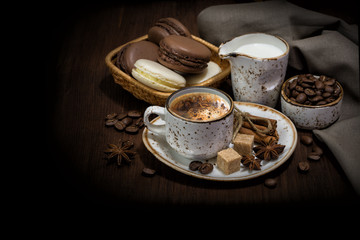 Cup of coffee, macaroons and linen napkin