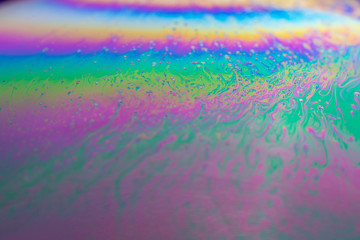 Fototapeta na wymiar abstract background iridescent iridescent interference rainbow on a soap bubble.
