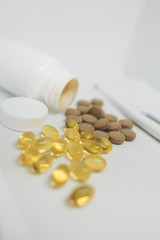 thermometer and tablets. medication for coronavirus. the coronavirus epidemic. propolis and fish...