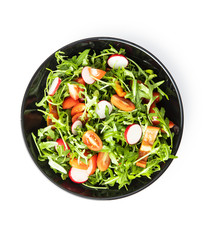Fresh arugula salad with radishes, tomatoes and red peppers.