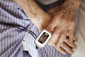 Oximeter test elder patient in prevention of Covid 19 pneumonia on a nursing home