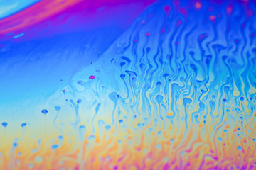 Fototapeta na wymiar Psychedelic background surface of colorful soap bubble