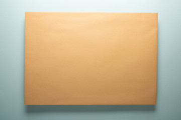 Yellow paper envelope with shadow. Paper texture