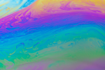 abstract background iridescent paint, in warm colors iridescent interference rainbow