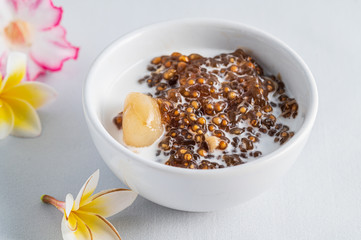 Thai desserts, sago desserts with longan topped with coconut milk
